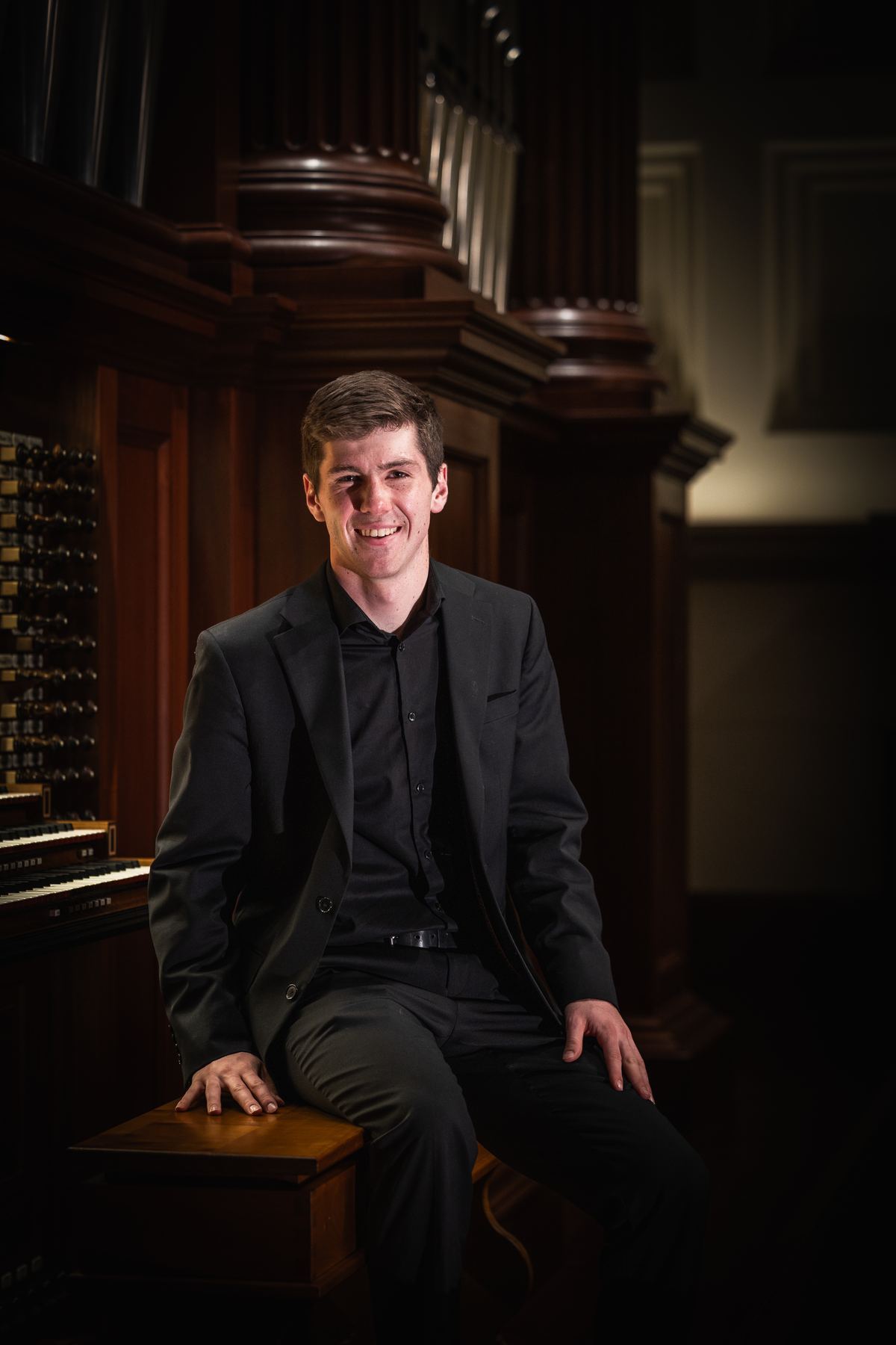 Organist seated at pipe organ for Michigan wedding ceremony
